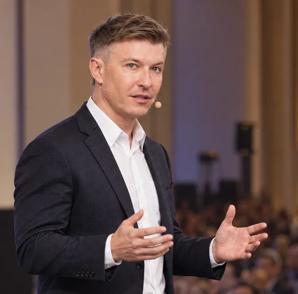 Zavialov Ilia Nikolaevich with a headset microphone during a presentation